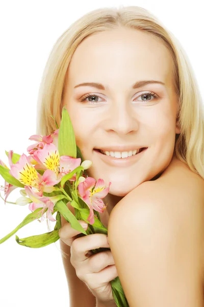 Young beautiful woman with pink flower — Stock Photo, Image