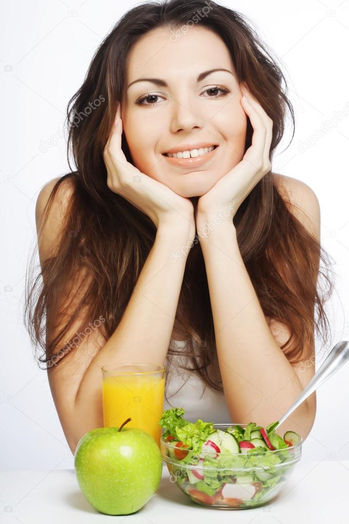 young woman has breakfast salad