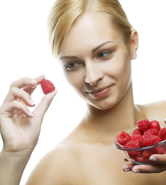 Woman eating a raspberry. Isolated over white — Stock Photo, Image