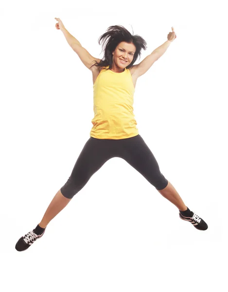 Fitness woman jumping of joy. — Stock Photo, Image