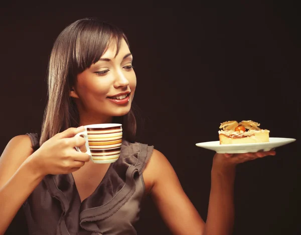 Young woman with a cake and coffee — Stock Photo, Image