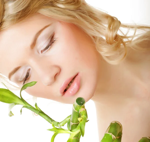 Beautiful woman with bamboo — Stock Photo, Image