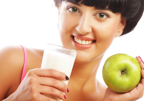 Woman with apple and milk — Stock Photo, Image