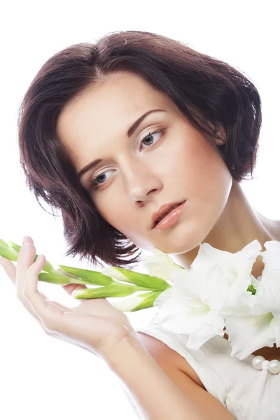 Woman with gladiolus flowers in her hands — Stock Photo, Image