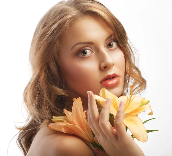 Young woman with yellow lily — Stock Photo, Image