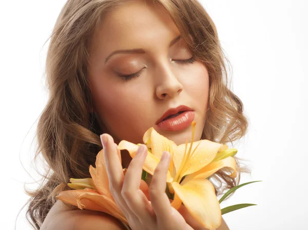 Young woman with yellow lily Stock Picture