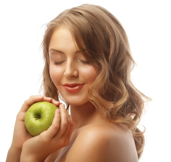 Vrouw met groene appel. Stockafbeelding