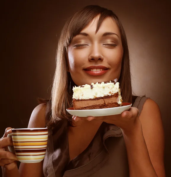 Young woman with a cake and coffee — Stock Photo, Image