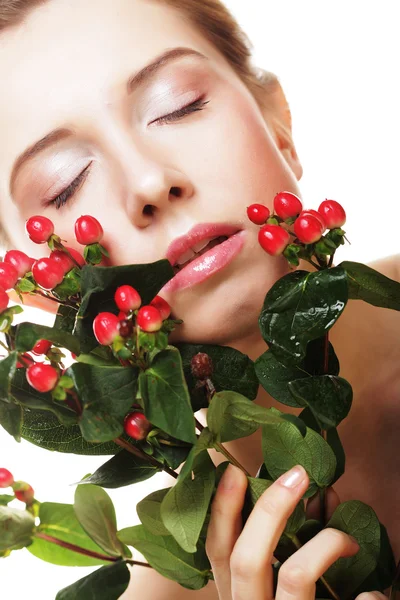 Beautiful woman with red flowers — Stock Photo, Image