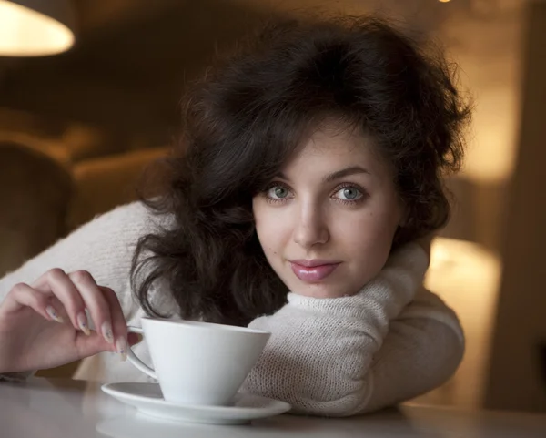 Young beautiful woman with a white cup — Stock Photo, Image
