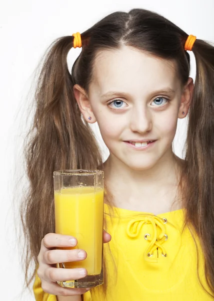 Portrait of girl drinking orange juice — Stock Photo, Image