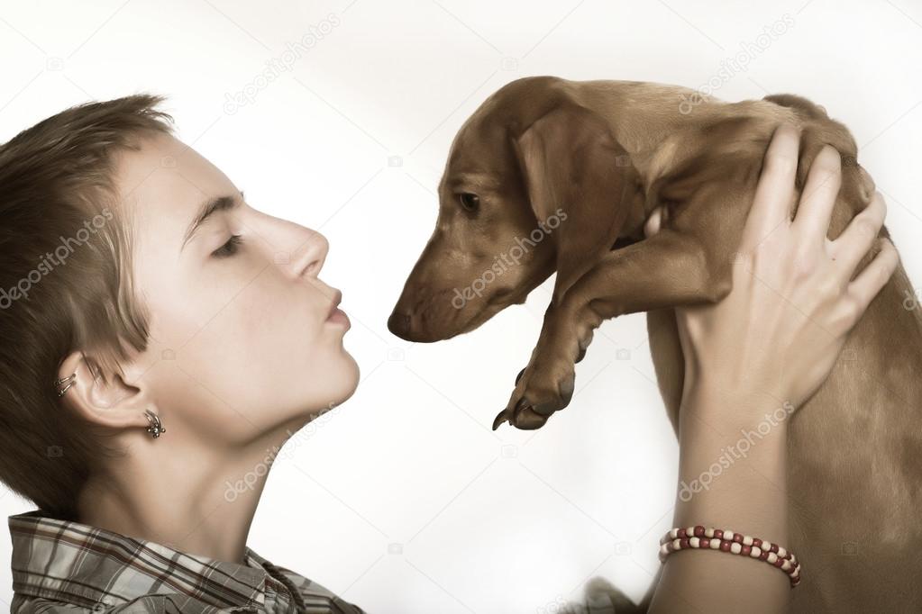 Young woman with a dachshund