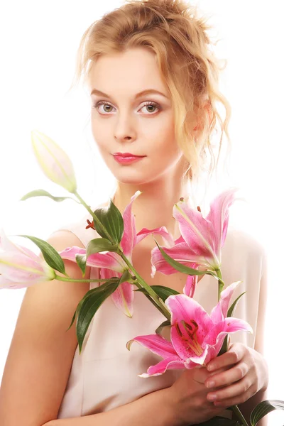 Junge Frau mit rosa Lilie — Stockfoto