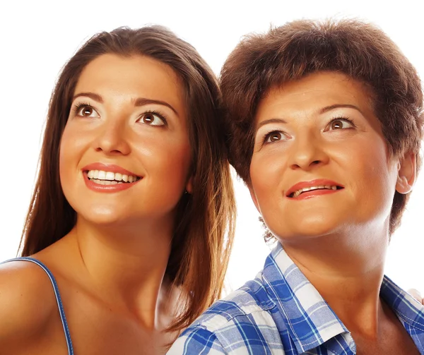 Mother and adult daughter looking up — Stock Photo, Image