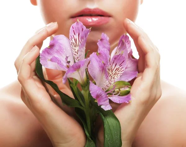 Beautiful woman with pink flower — Stock Photo, Image