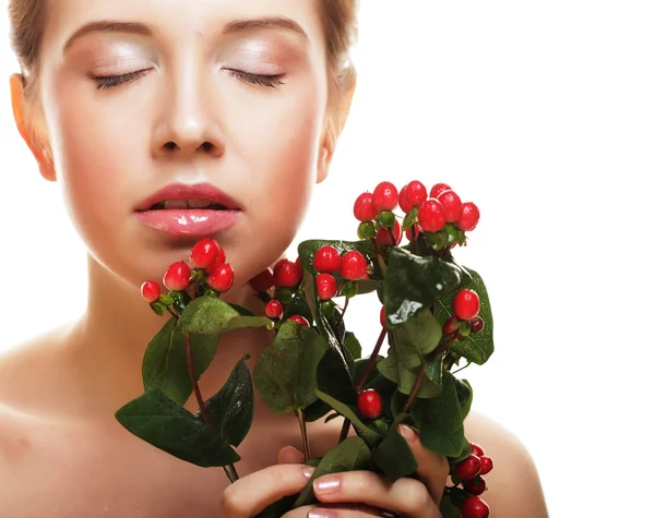 Beautiful woman with red flowers — Stock Photo, Image