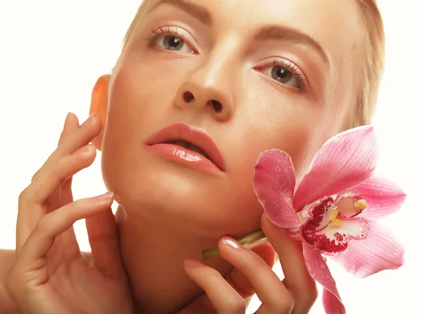 Young woman with pink orchid — Stock Photo, Image