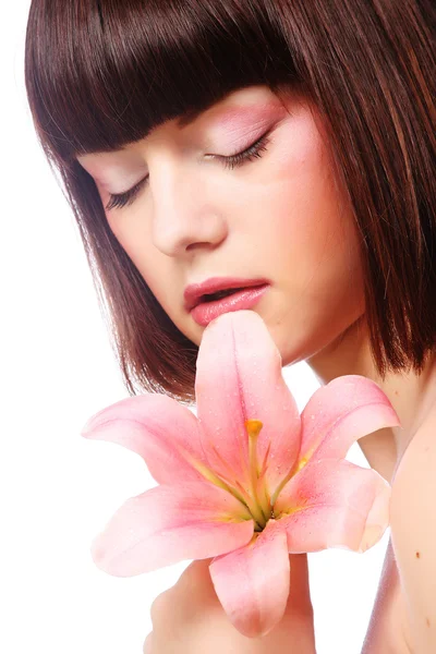 Schöne Frau mit rosa Blume — Stockfoto