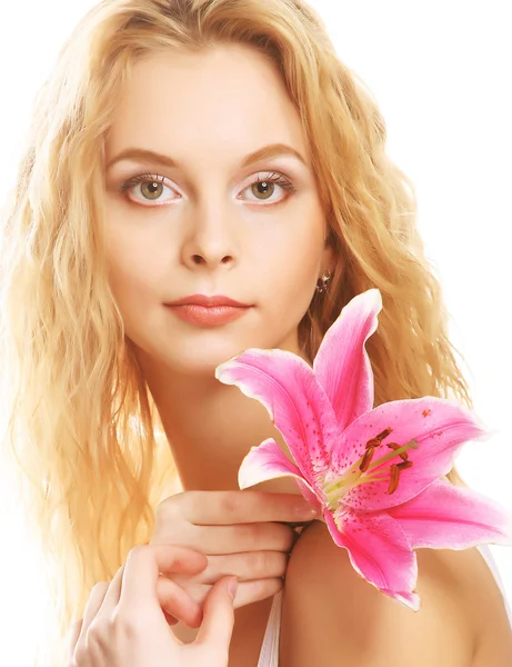 Young woman with pink lily Stock Photo