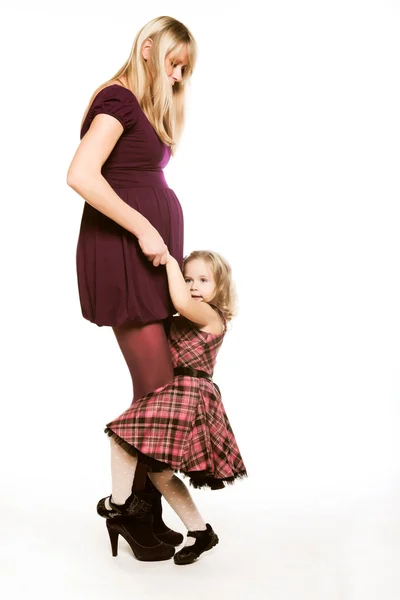 Pregnant woman with little daughter — Stock Photo, Image