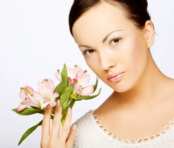 Beautiful woman with  pink flower — Stock Photo, Image