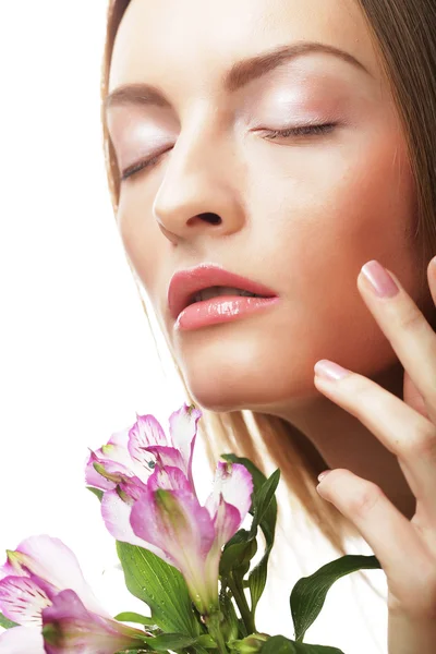 Young happy woman with pink flowers — Stock Photo, Image