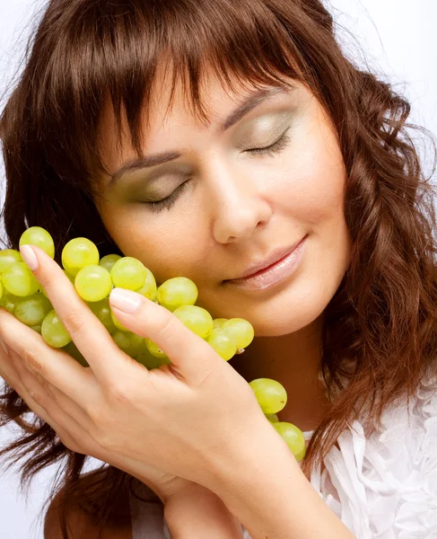 Young woman with green grapes — Stock Photo, Image