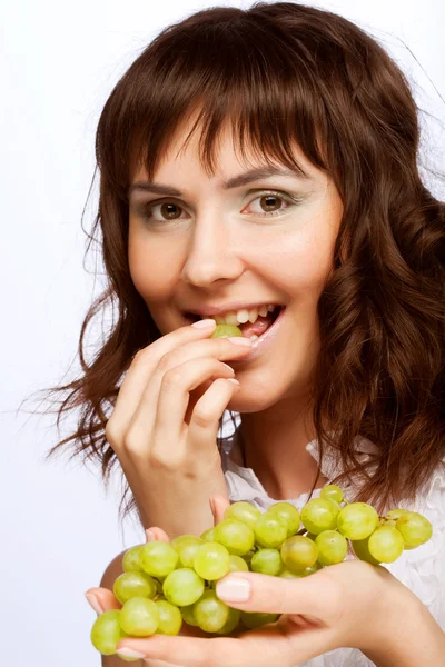 Young woman with green grapes — Stock Photo, Image