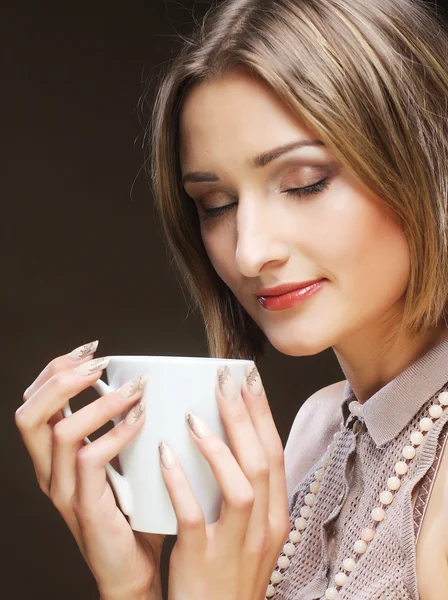 Young pretty woman drinking coffee — Stock Photo, Image