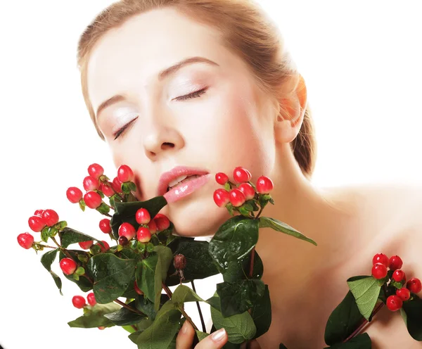 Beautiful woman with red flowers — Stock Photo, Image