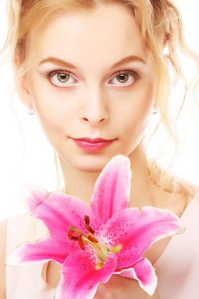 Young woman with pink lily — Stock Photo, Image