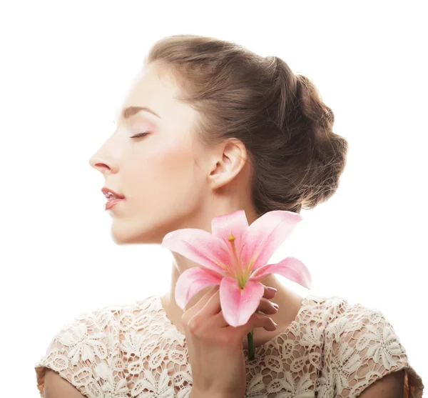 Girl holding lily flower in her hands — Stock Photo, Image