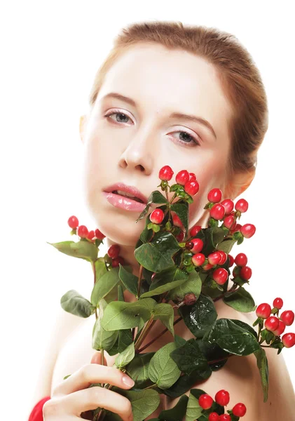 Beautiful woman with red flowers — Stock Photo, Image