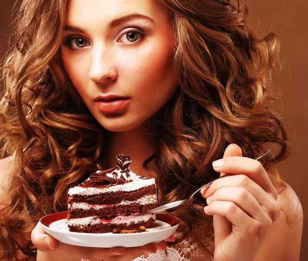 Beautiful young woman with a cake — Stock Photo, Image