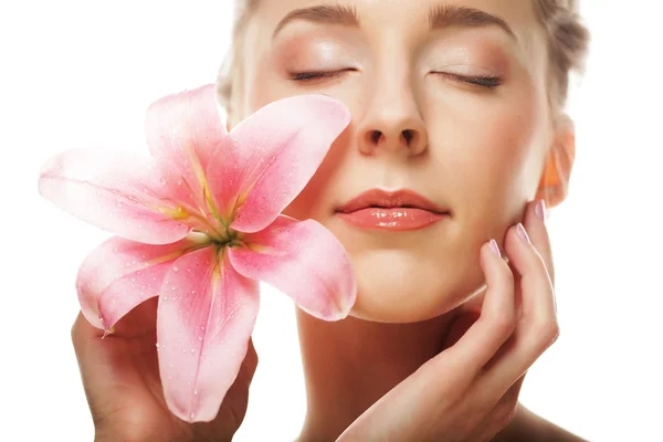 Beauty face of the young woman with pink lily — Stock Photo, Image