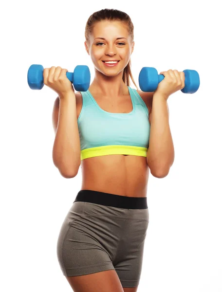 Vrouw in sportuitrusting oefenen met handgewichten — Stockfoto