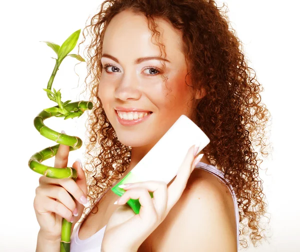 Beautiful spa girl holding jar of cream and bamboo — Stock Photo, Image