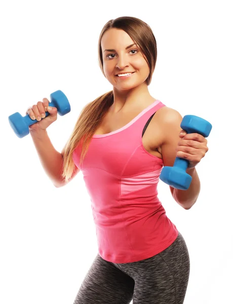 Vrouw in sportuitrusting oefenen met handgewichten — Stockfoto