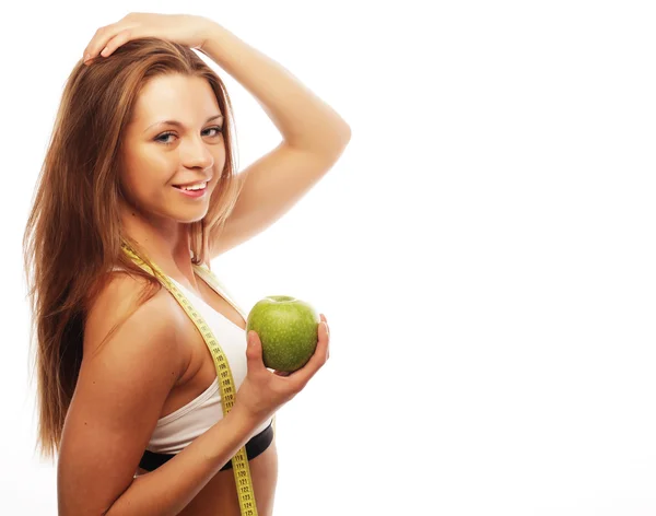 Joven mujer alegre en ropa deportiva con manzana — Foto de Stock