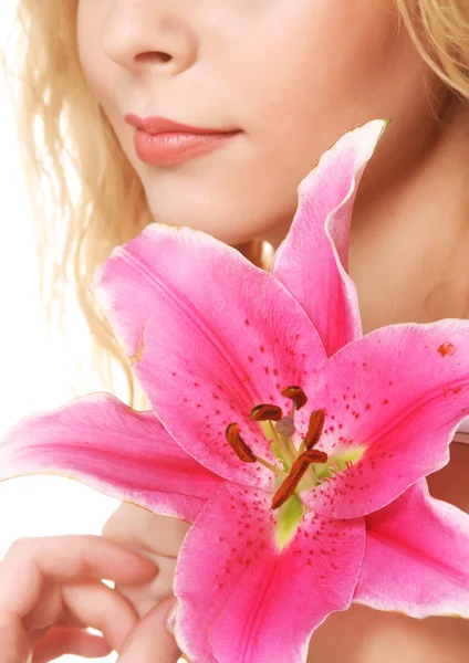 Young woman with pink lily Stock Picture