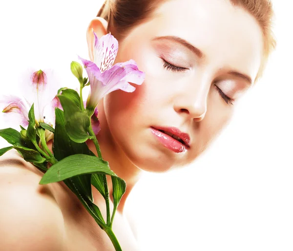 Beautiful woman with pink flower — Stock Photo, Image