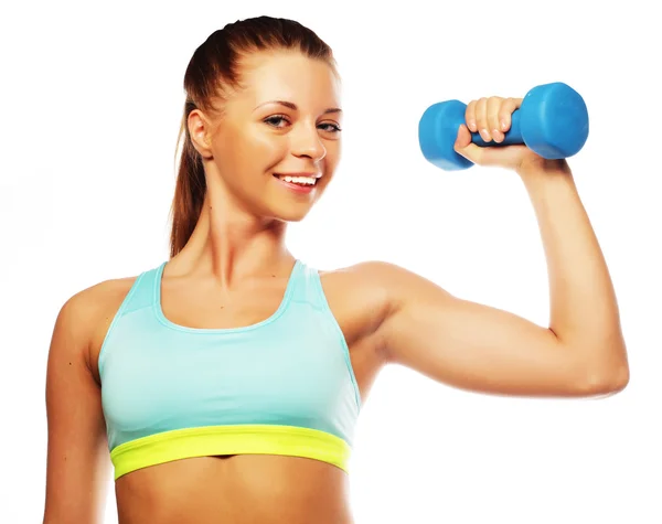 Vrouw in sportuitrusting oefenen met handgewichten — Stockfoto