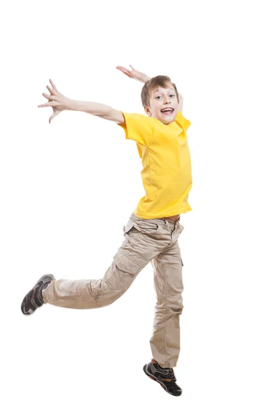 Funny little child in colorful t-shirt jumping and laughing over white background — Stock Photo, Image