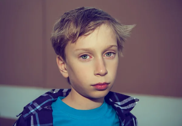 Portrait of a beautiful blond boy looking very sad and frustrated — Stock Photo, Image