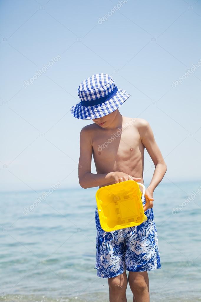 Image result for child pouring water into the ocean