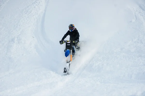 Snowmobile in winter forest in the mountains of Sakhalin Island — Stock Photo, Image