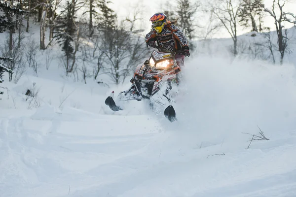 Snowmobile in winter forest in the mountains of Sakhalin Island — Stock Photo, Image