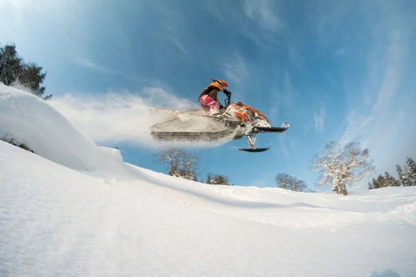 Snowmobile in winter forest in the mountains of Sakhalin Island — Stock Photo, Image