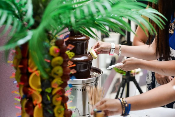 Chocolate fountain  and fruits