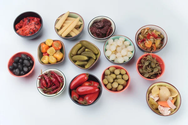 Pickled cucumber, olives and vegetables — Stock Photo, Image